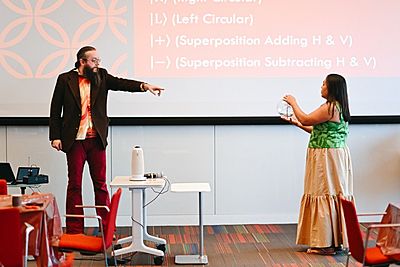 Science teacher Adam Davenport from Bowen High School on Chicago’s South Side demonstrates the “blorb,” a hands-on method of explaining quantum gateways he created and workshopped through the UChicago Pritzker School of Molecular Engineering’s TeachQuantum program. (Photo by Elaina Eichorn)