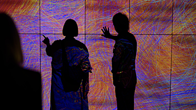 Visitors view Order in Chaos, an interactive installation on exhibition in teamLab: Everything Exists in Infinite Continuity, now on display at the Smart Museum of Art through Feb. 21. Photo by Jason Smith