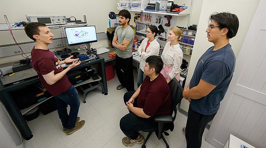 Adrian Nava (center, seated) said the lessons from the instructors, many of whom were selected due to their own nontraditional paths to STEM, have led him to consider pursuing a PhD after graduation. (Photo by Jason Smith)